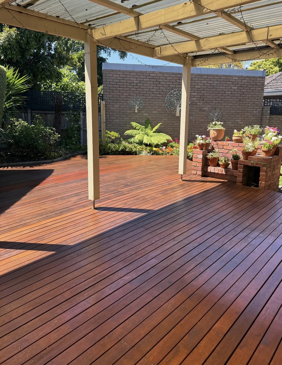 Refurbished timber deck beneath a covered outdoor area